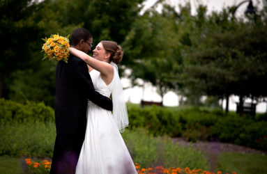 Kristy & Nathaniel wearing a David's Bridal Wedding Gown